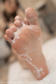 A close up of a person's foot covered in foam.